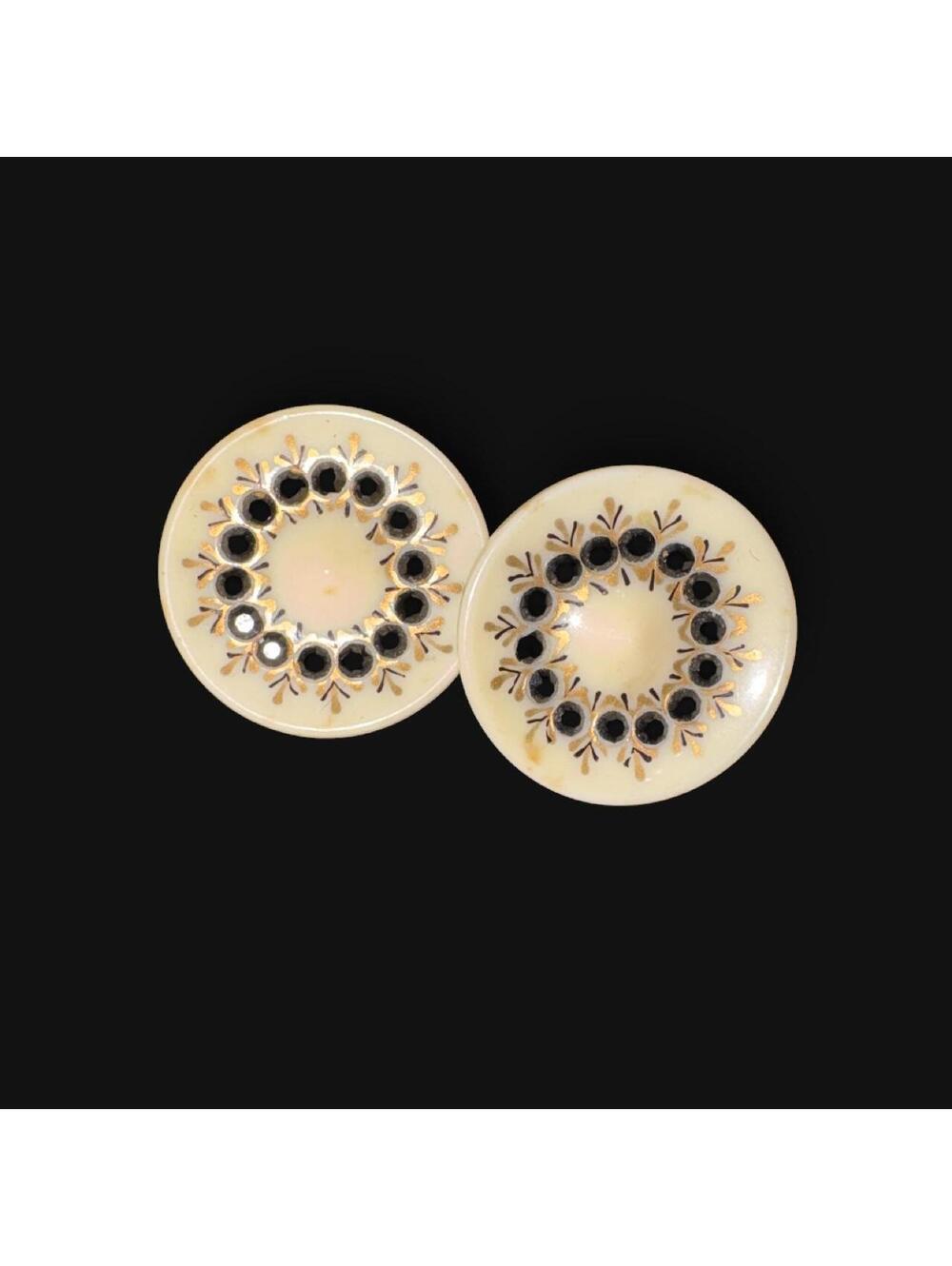 vintage round clip-on earrings featuring a domed base